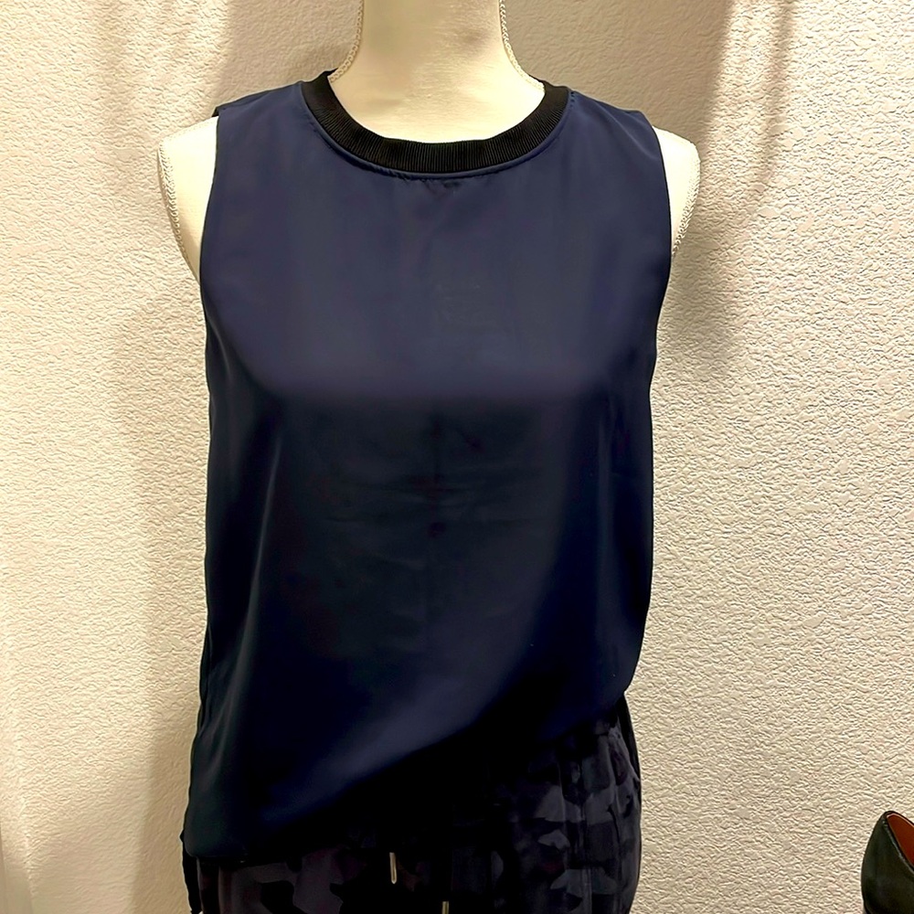 Mango Suit ribbed neck tee without sleeves. Blue body and black rib. Size 4.